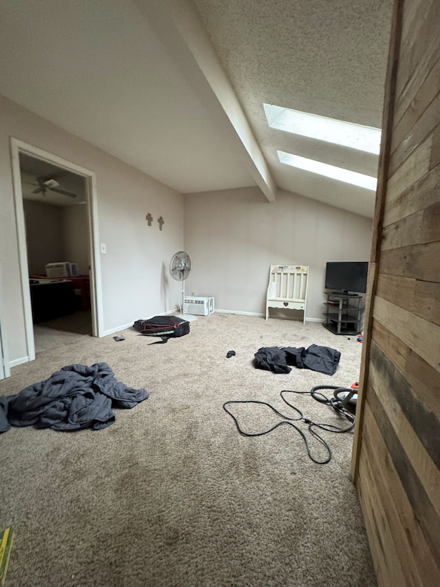 bonus room with vaulted ceiling with skylight, baseboards, and carpet