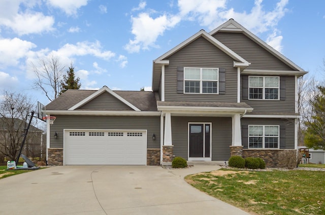 11619 Saddlebrook Cir, Freeland, MI 48623 - view of front of property with stone siding, an attached garage, concrete driveway, roof with shingles, and a front lawn