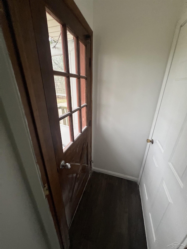3197 Studor Rd, Saginaw, MI 48601 - doorway to outside featuring baseboards and dark wood finished floors