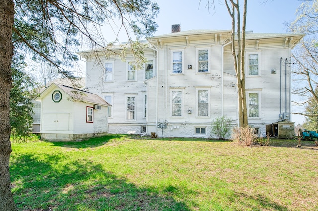 11811 Laird Rd, Brooklyn, MI 49230 - back of property featuring a lawn and a chimney