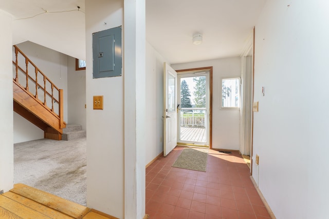 11811 Laird Rd, Brooklyn, MI 49230 - doorway with tile patterned floors, electric panel, and stairs