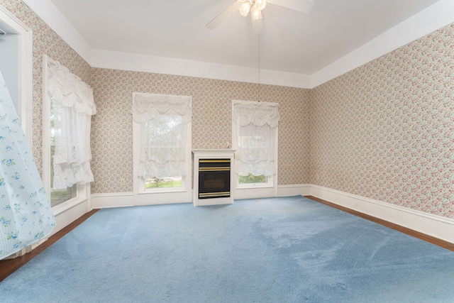 11811 Laird Rd, Brooklyn, MI 49230 - unfurnished living room featuring ceiling fan, wallpapered walls, and carpet floors