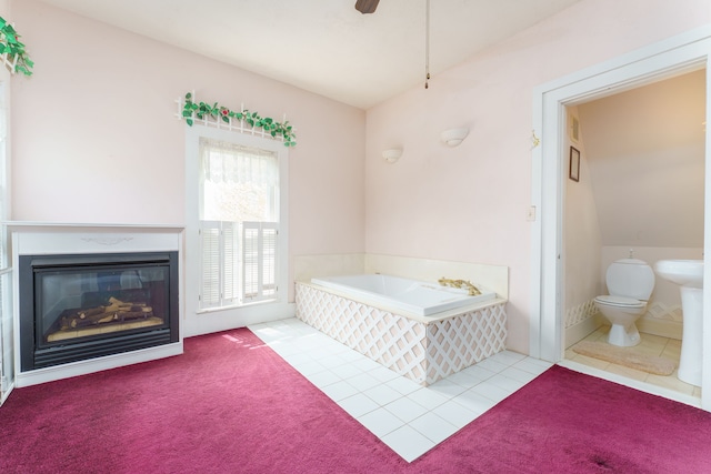 11811 Laird Rd, Brooklyn, MI 49230 - bedroom featuring ensuite bathroom, carpet floors, tile patterned floors, and a glass covered fireplace