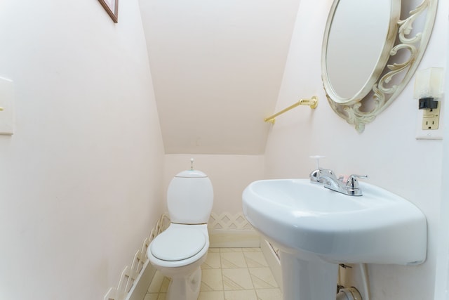 11811 Laird Rd, Brooklyn, MI 49230 - bathroom with tile patterned floors, toilet, and a sink