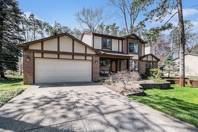english style home featuring driveway, a front lawn, an attached garage, and brick siding