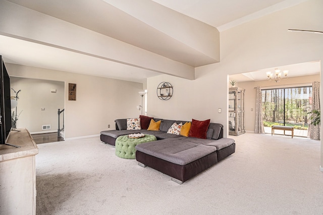 living area featuring an inviting chandelier, visible vents, carpet flooring, and baseboards