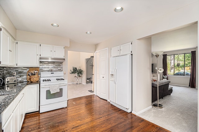 kitchen featuring white appliances, recessed lighting, white cabinets, and baseboards