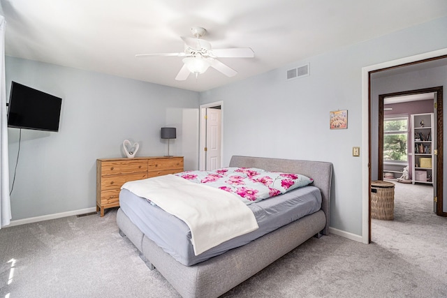 bedroom featuring visible vents, a ceiling fan, carpet flooring, and baseboards
