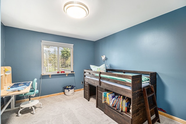 bedroom featuring baseboards and carpet flooring
