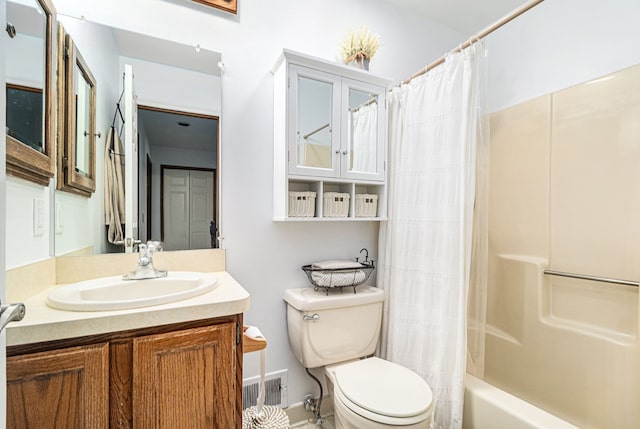 full bathroom with shower / bath combo, toilet, vanity, baseboards, and visible vents