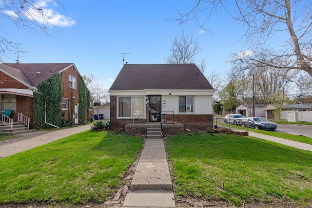 6545 Asbury Park, Detroit, MI 48228 - new england style home with brick siding and a front yard