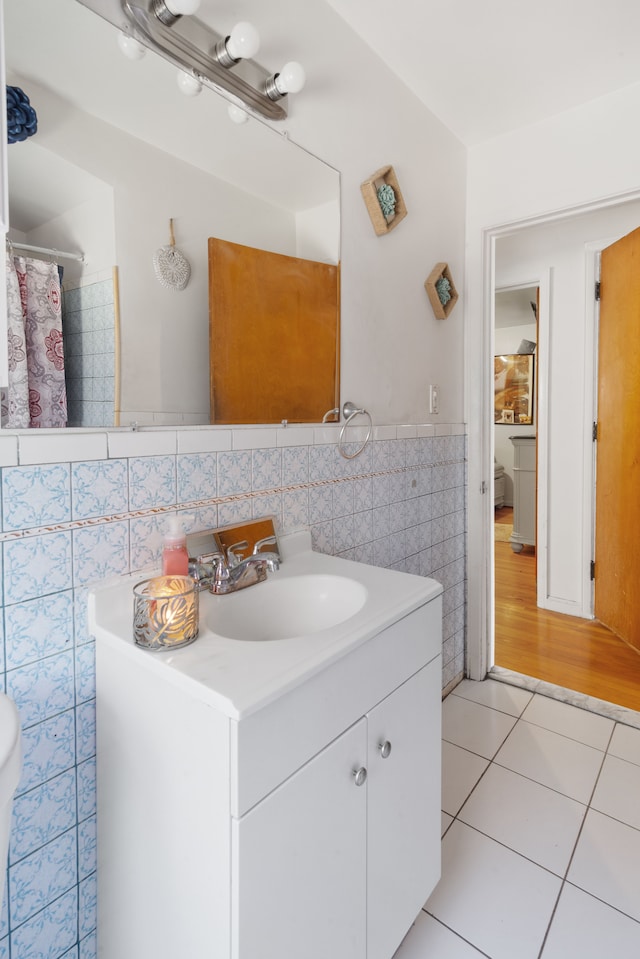 6545 Asbury Park, Detroit, MI 48228 - bathroom with tile walls, vanity, tile patterned floors, a wainscoted wall, and a shower with shower curtain