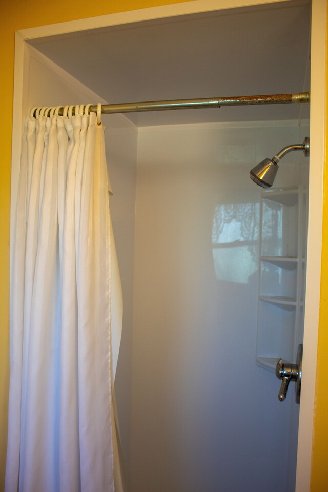 bathroom with a shower with curtain