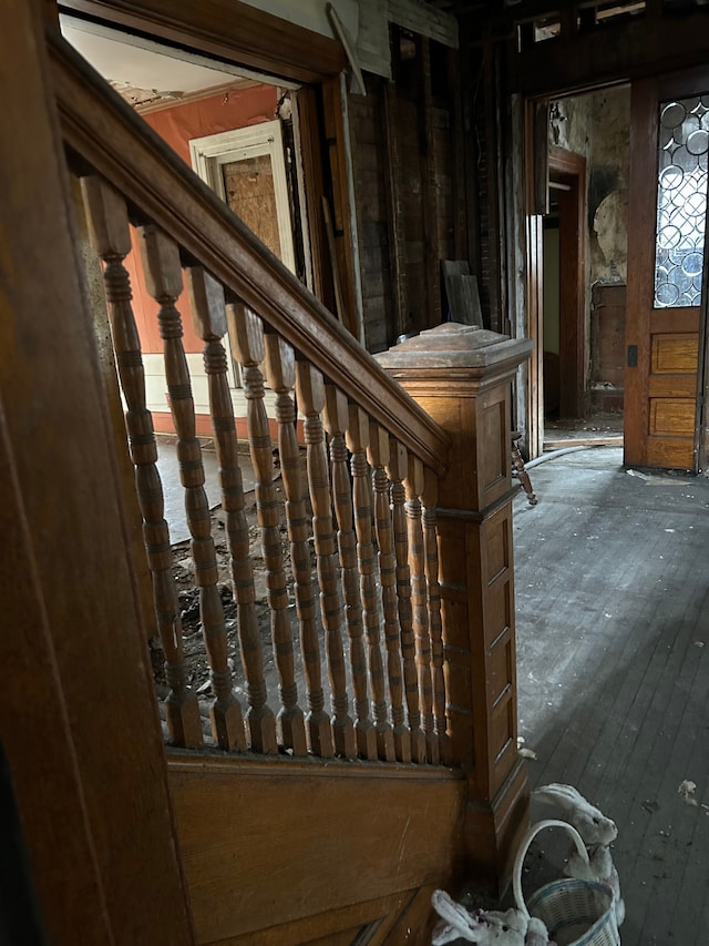 stairs with hardwood / wood-style floors