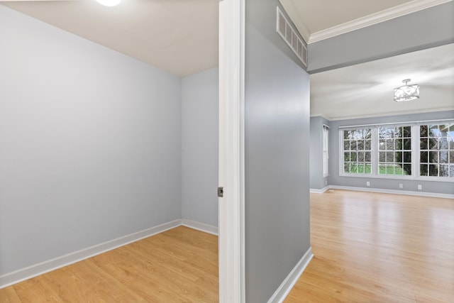 5580 Hegel Rd, Goodrich, MI 48438 - hall with baseboards, crown molding, visible vents, and wood finished floors