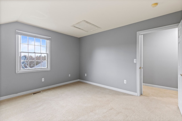 5580 Hegel Rd, Goodrich, MI 48438 - spare room featuring carpet flooring, visible vents, baseboards, and lofted ceiling