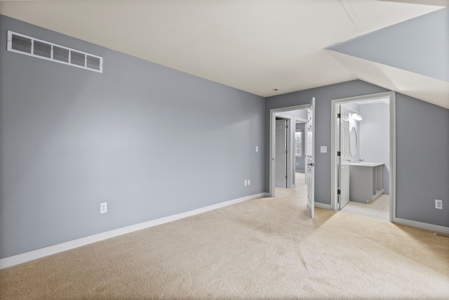 5580 Hegel Rd, Goodrich, MI 48438 - additional living space featuring lofted ceiling, light carpet, baseboards, and visible vents