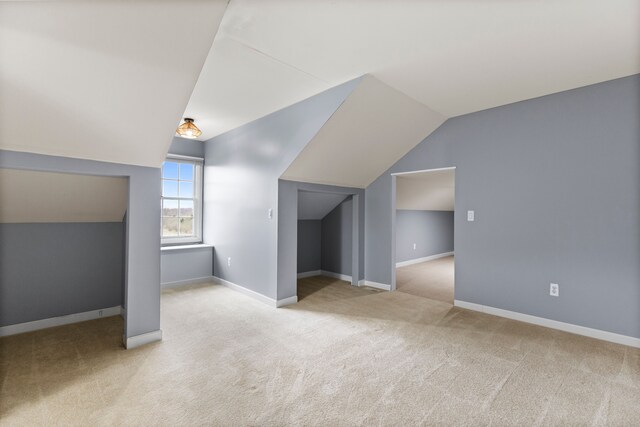 5580 Hegel Rd, Goodrich, MI 48438 - additional living space with carpet, baseboards, and lofted ceiling