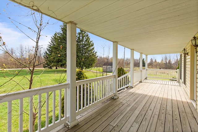 5580 Hegel Rd, Goodrich, MI 48438 - wooden terrace with covered porch and a yard