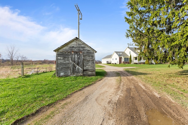 5580 Hegel Rd, Goodrich, MI 48438 - view of street featuring driveway