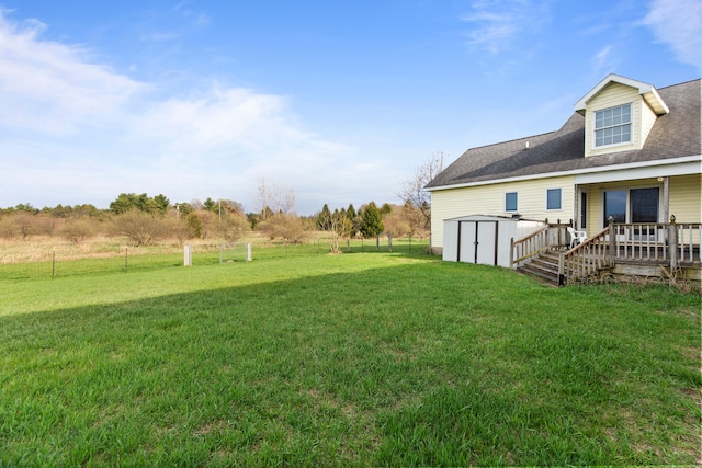 5580 Hegel Rd, Goodrich, MI 48438 - view of yard featuring a storage shed, a wooden deck, and an outdoor structure