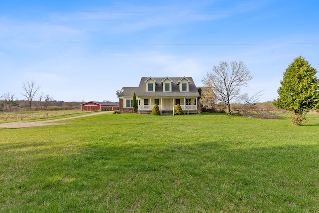5580 Hegel Rd, Goodrich, MI 48438 - cape cod home with covered porch, driveway, and a front yard