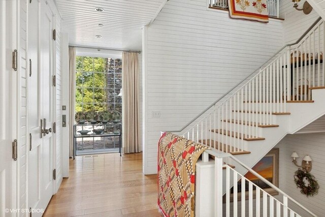 stairway featuring wood finished floors