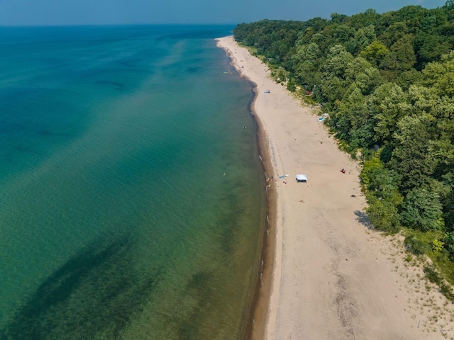 bird's eye view with a beach view and a water view