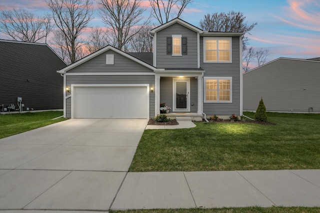 traditional home featuring an attached garage, driveway, and a front yard