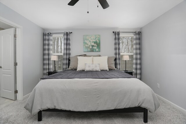 bedroom featuring baseboards and a ceiling fan