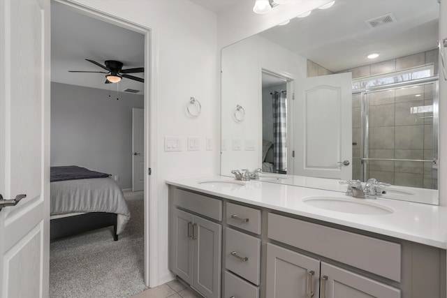bathroom featuring double vanity, a sink, ensuite bathroom, and visible vents