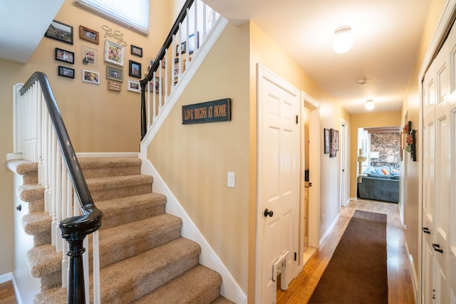 interior space with wood finished floors and baseboards