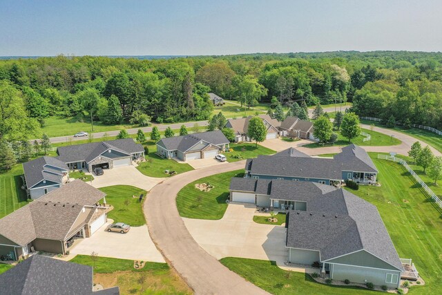 aerial view with a residential view and a wooded view