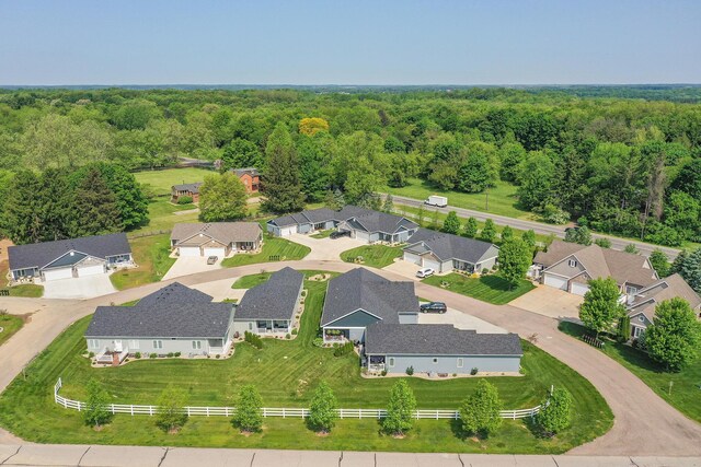 aerial view featuring a view of trees and a residential view