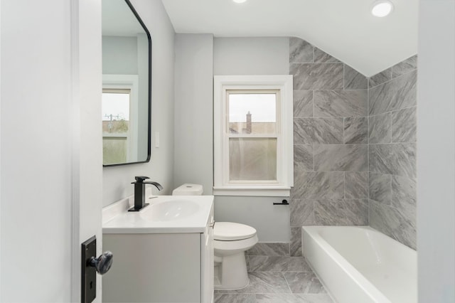 bathroom featuring vanity, marble finish floor, toilet, and a wealth of natural light