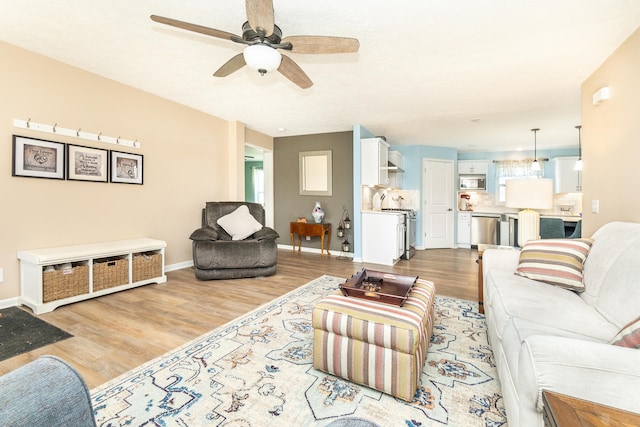 48320 Martz Rd, Michigan, MI 48111 - living area featuring light wood-style floors, baseboards, and ceiling fan