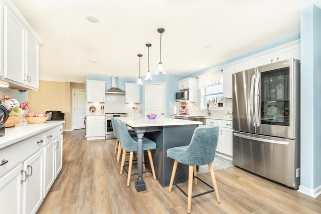 48320 Martz Rd, Michigan, MI 48111 - kitchen featuring white cabinets, wall chimney exhaust hood, and appliances with stainless steel finishes