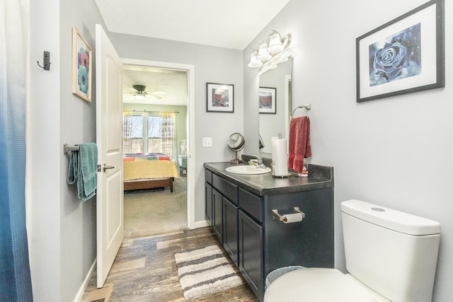 48320 Martz Rd, Michigan, MI 48111 - ensuite bathroom with vanity, toilet, a ceiling fan, wood finished floors, and ensuite bath