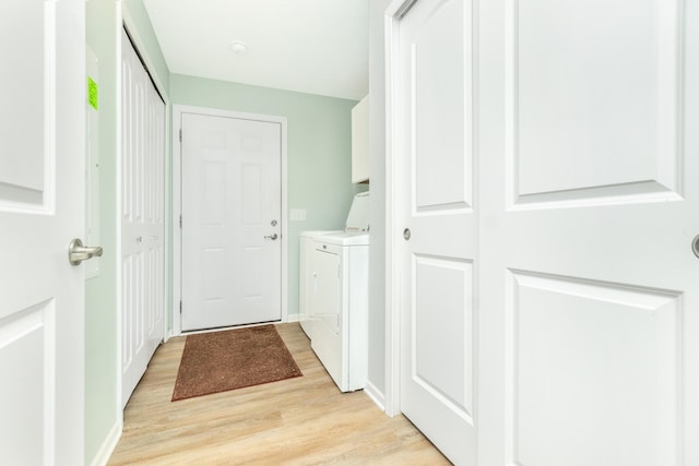 48320 Martz Rd, Michigan, MI 48111 - clothes washing area with light wood-type flooring, baseboards, washer and clothes dryer, and laundry area