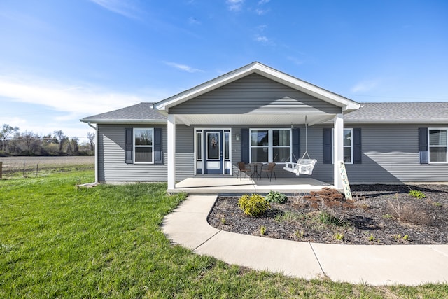 48320 Martz Rd, Michigan, MI 48111 - rear view of house with a porch, a yard, and a shingled roof