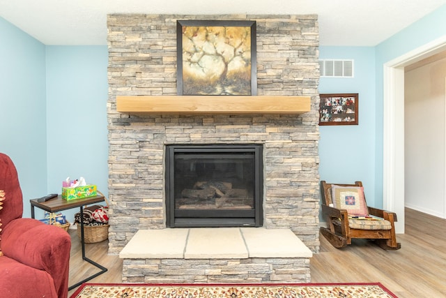 48320 Martz Rd, Michigan, MI 48111 - details featuring wood finished floors, visible vents, baseboards, and a stone fireplace
