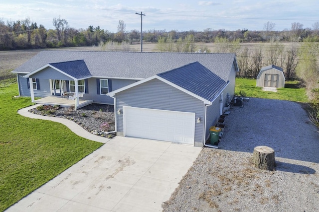 48320 Martz Rd, Michigan, MI 48111 - ranch-style house featuring a garage, a storage unit, a front yard, and concrete driveway