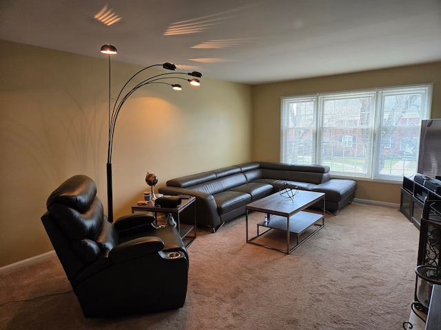 carpeted living room with baseboards
