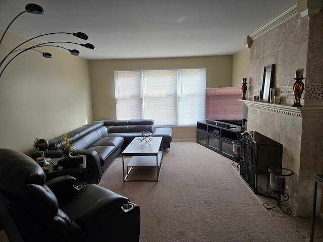 living area with carpet and a tiled fireplace