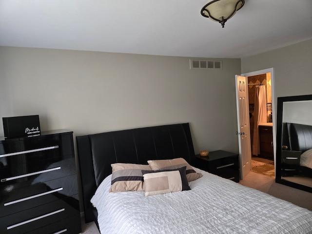bedroom featuring carpet and visible vents
