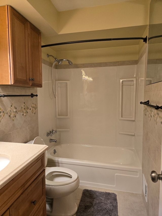 bathroom with toilet, vanity, tile patterned flooring, decorative backsplash, and bathtub / shower combination