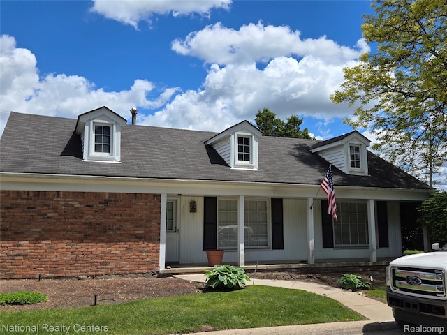 450 Billingsgate Unit C, Bloomfield Hills, MI 48301 - new england style home featuring a porch and brick siding