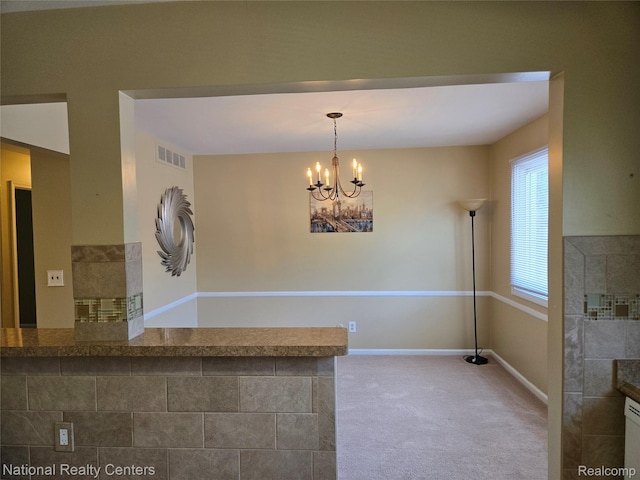 450 Billingsgate Unit C, Bloomfield Hills, MI 48301 - kitchen featuring carpet flooring, a chandelier, and hanging light fixtures