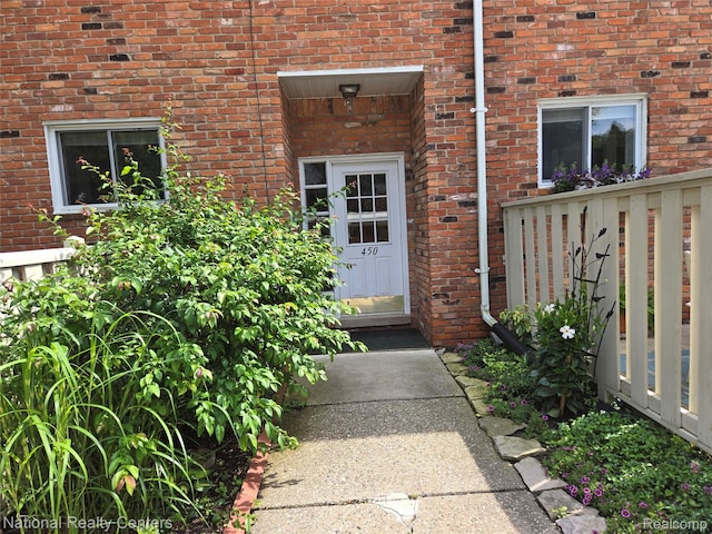 450 Billingsgate Unit C, Bloomfield Hills, MI 48301 - doorway to property featuring brick siding