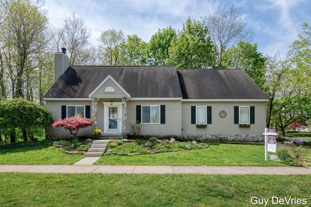 2658 Golfridge Dr SE, Grand Rapids, MI 49546 - view of front facade featuring a front yard and a chimney